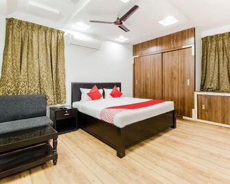 Hotel O Flagship 40630 Sriman Inn - Guntūr - Bedroom