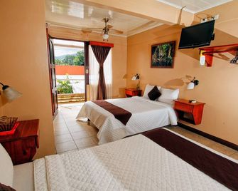 Hotel Las Colinas - לה פורטונה - חדר שינה