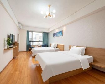 Zhumei Impression Apartment (Qingdao Guoxin Convention And Exhibition Center Shop) - 青島 - 臥室