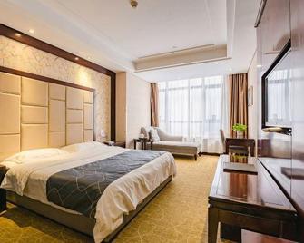 Huangguan Business Hotel - Xinyang - Camera da letto