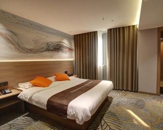 Daqing Weige Hotel (Daqing East Station) - Daqing - Schlafzimmer