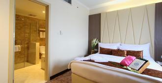Lorin Syariah Hotel Solo - Surakarta City - Κρεβατοκάμαρα