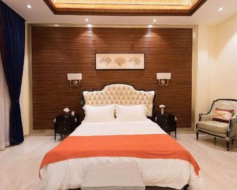 Hanamitsu Hotel & Spa - Garapan - חדר שינה