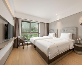 Magnotel Taizhou Jiaojiang Yunxi Road Yanyu Park - Taizhou - Schlafzimmer