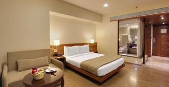 Hotel Temple Tree Shirdi - Shirdi - Schlafzimmer