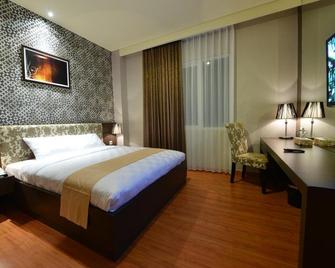 Wixel Hotel Kendari - Кендарі - Спальня