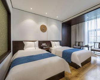 Qianna Hotel (Zhoukou Hanyang Road) - Zhoukou - Bedroom