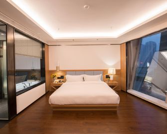 Floral Chongqing Guanyinqiao Star Hotel - צ'ונגקינג - חדר שינה