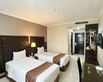Grand Antares Hotel - Medan - Slaapkamer