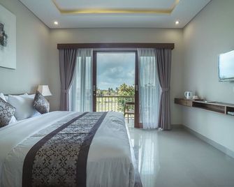 Putih Dcarik Ubud - אובוד - חדר שינה