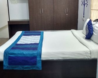 Single Room Hitech Shilparamam Guest House - היידרבד - חדר שינה