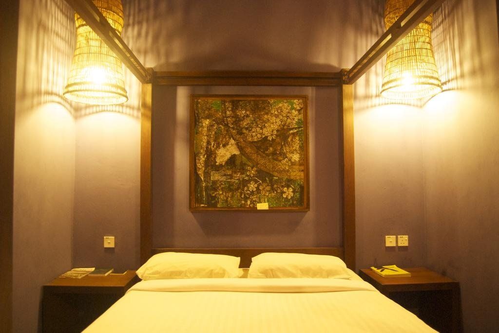 Singgahsana Lodge - קוצ'ינג - חדר שינה