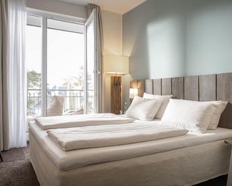 ساند لايفستايل هوتل - تيمميندورفر ستراند - غرفة نوم