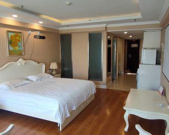 Jinjiang Holiday Inn Apartment (Qunli Yintai City Branch) - Harbin - Sypialnia