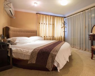 Xin Hui Hotel (Xujiahui Shanghai Stadium Metro Station Branch) - Shanghai - Schlafzimmer