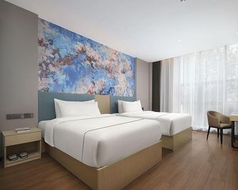 Magnolia Hotel (Nanjing Software Guke Chuangcheng Niushoushan Branch) - Nanjing - Bedroom
