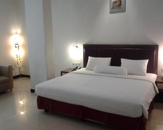 Agung Hotel Kendari - Кендарі - Спальня