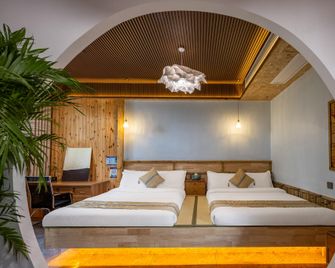 Floral Hotel Rizhao Shanhai Luoxi Homestay Hotel - Rizhao - Bedroom