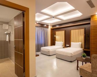 Hotel Palm International - Butwāl - Bedroom