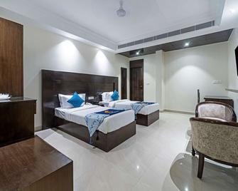 Comfort Inn Rishikesh - Rishikesh - Спальня