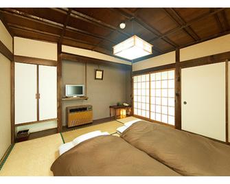 Hotel Marui - Shibata - Camera da letto
