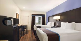 Days Inn & Suites by Wyndham Galveston West/Seawall - גאלבסטון - חדר שינה