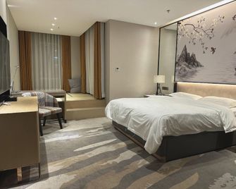 Yijia Resort Hotel (Dandong No. 4 Middle School Branch) - Dandong - Schlafzimmer