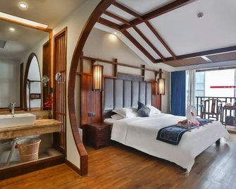 Huan Sha Ju Hotel - Zhangjiajie - Schlafzimmer
