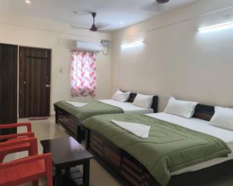 Hotel Vishnu Grand - Tirupati - Slaapkamer
