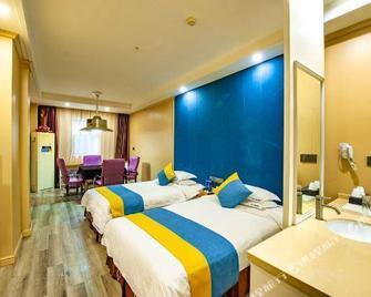 Xinshidai Boutique Hotel (Yichang Shengshi Tianxia) - Yichang - Bedroom