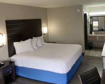 Days Inn by Wyndham Moss Point Pascagoula - Moss Point - Спальня