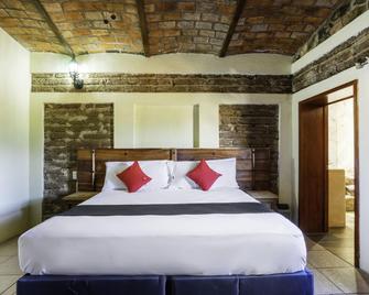 Capital O Hotel Posada Terraza - Tequila - Schlafzimmer