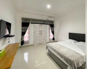 Hotel Lucky 21 Syariah Mitra RedDoorz - Lubuklinggau - Habitación