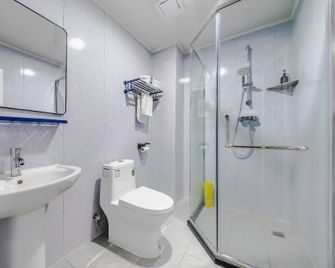7Days Inn Qingdao Haiyunan Xinglong Road - تشينغداو - غرفة نوم