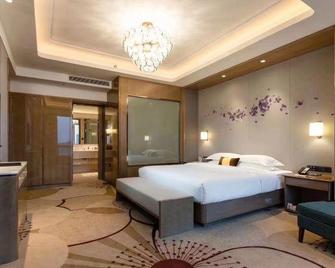 Taizhou Yaoda International Hotel - Taizhou - Bedroom