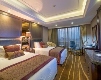 Care Feeling Grand Hotel - Deyang - Bedroom