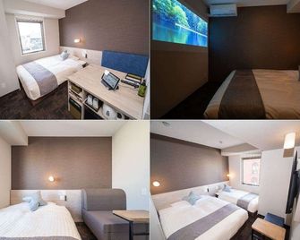 Super Hotel Premier Saitama Higashiguchi - Saitama - Ložnice