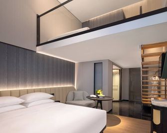 كانمينج كاسن هوتل - كونمينغ - غرفة نوم