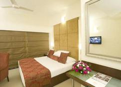Hotel Express Towers - Vadodara - Phòng ngủ