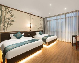 Youlan Garden Hotel (Chongqing West Station · Baguo City Branch) - Chongqing - Bedroom