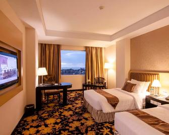 Rocky Plaza Hotel Padang - Padang - Bedroom