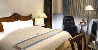 Hotel Grand Tiga Mustika - Balikpapan - Bedroom