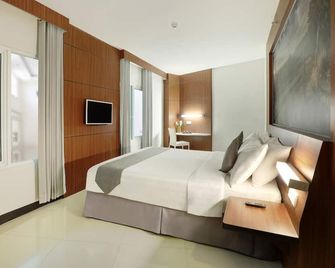Hotel Neo Palma - Palangkaraya by Aston - Palangkaraya - Bedroom