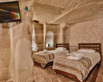 Cappadocia Caves Hotel - גורמה - חדר שינה