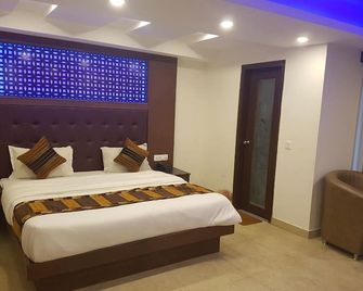 هوتل هامرز إنترناشونال - موسوري - غرفة نوم