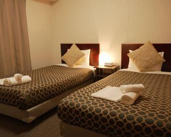 Hotel The Garden VI Ichinomiya - Ichinomiya - Slaapkamer