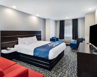Days Inn & Suites by Wyndham Horn Lake/Memphis Graceland - Horn Lake - Schlafzimmer
