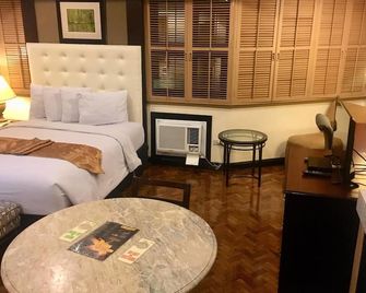 Lourdes Family Suites Makati powered by Cocotel - מנילה - חדר שינה