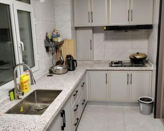 ‌Chuliu Holiday Homes (Luquan Branch, near Hebei Provincial Second Hospital) - Shijiazhuang - Kitchen