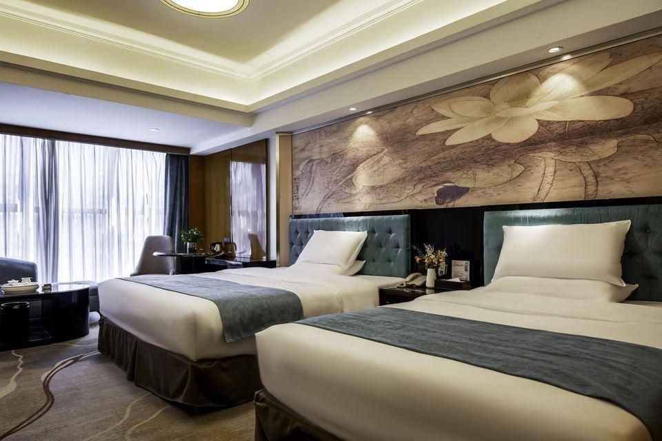 Shishi Wanjia International Hotel - קואנג'ואו - חדר שינה